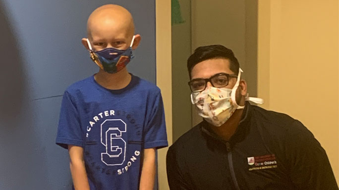 Carter with patient care manager Fatir Khan, RN, BSN. 