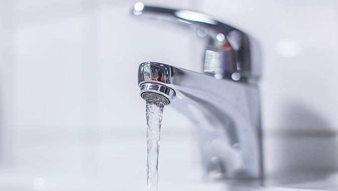 Clear water running from a faucet