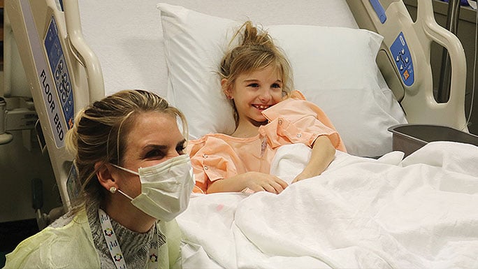 Youngpatient Allissa Boyer enjoys an improv comedy performance by Humor for Hope during her hospital stay at Comer Children