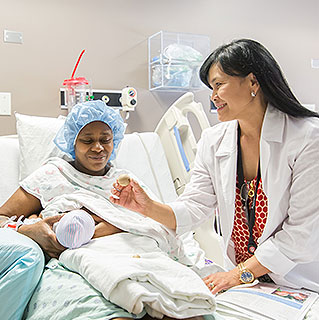 Lactation consultant Julita Ando offers breastfeeding support at a new mom