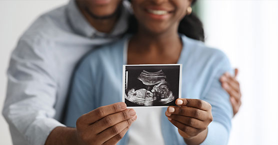 Couple holding sonogram