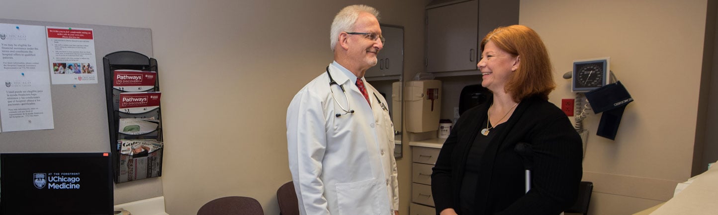 Thoracic surgeon Marc Ferguson, MD, and patient that is an employee