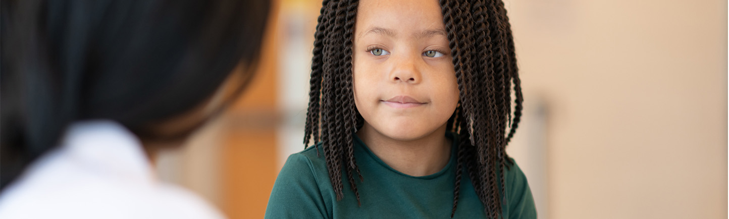 Image of pediatric pulmonary patient talking to doctor