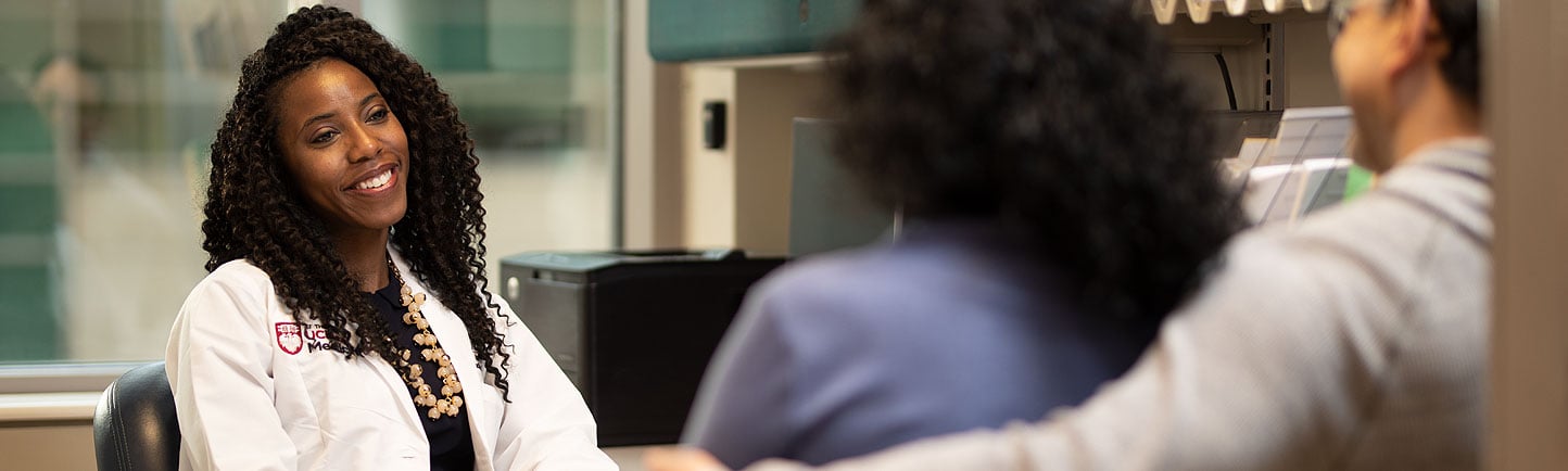 Reproductive endocrinologist Amanda Adeleye, MD, consulting with a couple