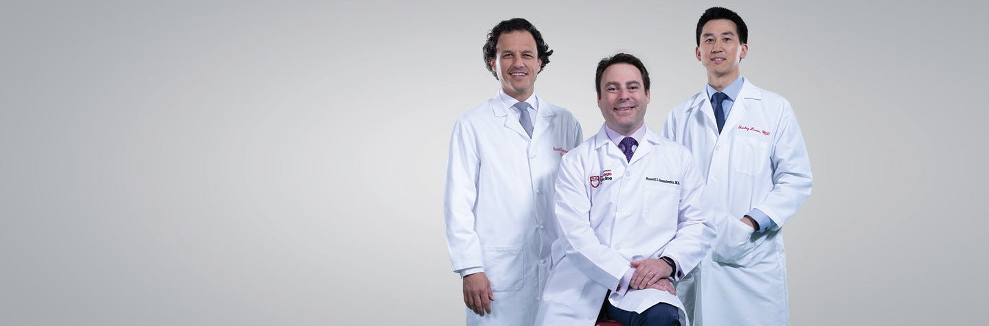 3 UChicago Medicine prostate cancer physicians in white lab coats.