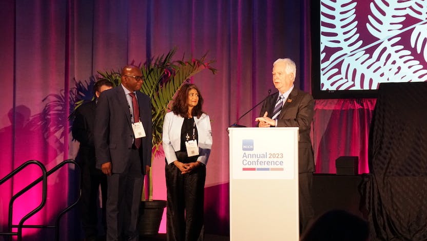 Kunle Odunsi, MD, PhD, Director of the UChicago Medicine Comprehensive Cancer Center; Sonali M. Smith, MD, Chief, Section of Hematology/Oncology at UChicago Medicine; and Robert W. Carlson, MD, NCCN's Chief Executive Officer on stage during the NCCN annual conference in April.
