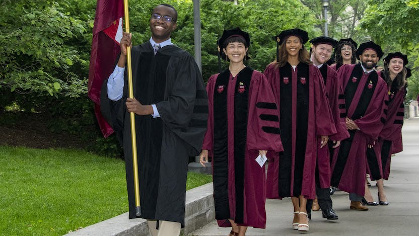 Members of Pritzker School of Medicine's Class of 2024 make their way into Rockefeller Memorial Chapel May 24 for their division academic ceremony.