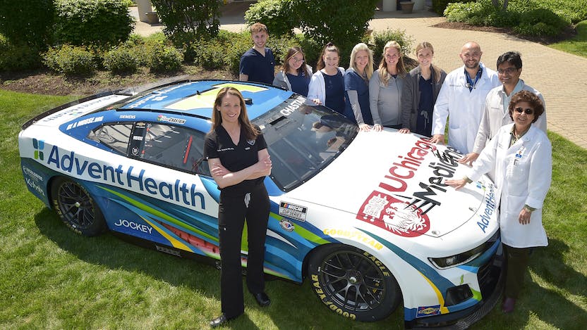 UChicago Medicine AdventHealth will serve as the Official Health Care Partner of the NASCAR Chicago Street Race Weekend, providing care for drivers, crew and NASCAR staff in the Infield Care Center. Katie Tataris, MD, MPH, (center) an emergency room physician and Associate Professor of Medicine, will be the race medical director.