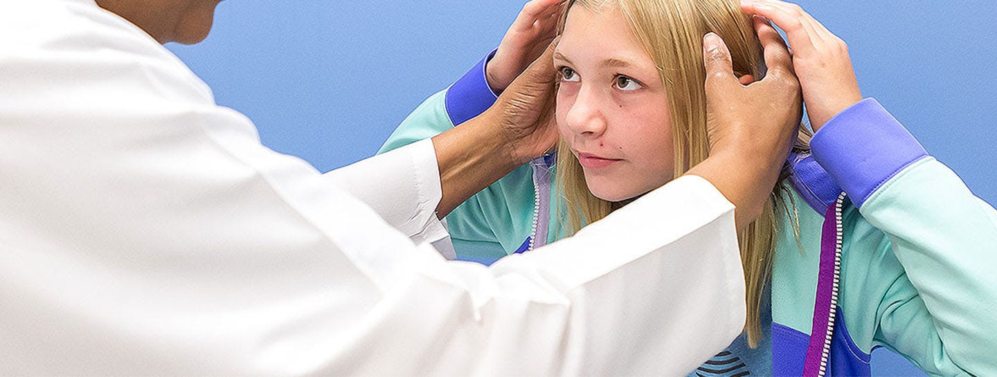 Pediatric neurologists works with young patient