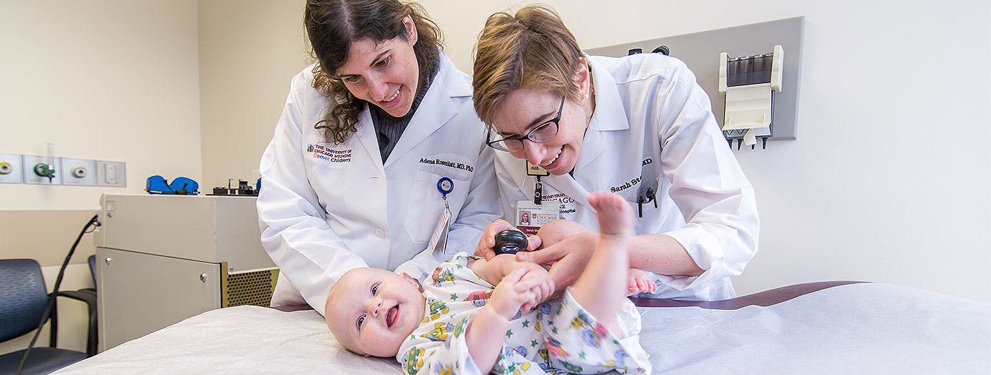Pediatric dermatologists Dr. Adena Rosenblatt and Dr. Sarah Stein observing a baby