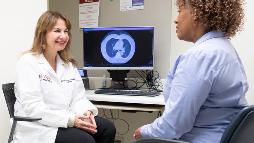 Maria Chiara Garassino, MD, with patient in clinic