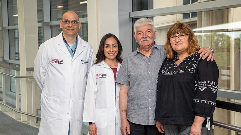 UChicago Medicine nurse practitioner Flor Cerda and lung transplant surgeon Pablo Sanchez, MD, pose with Ben Guajardo and his wife, Juanita. In May 2024, Ben underwent a double lung transplant with the hospital's Latino Transplant Program.
