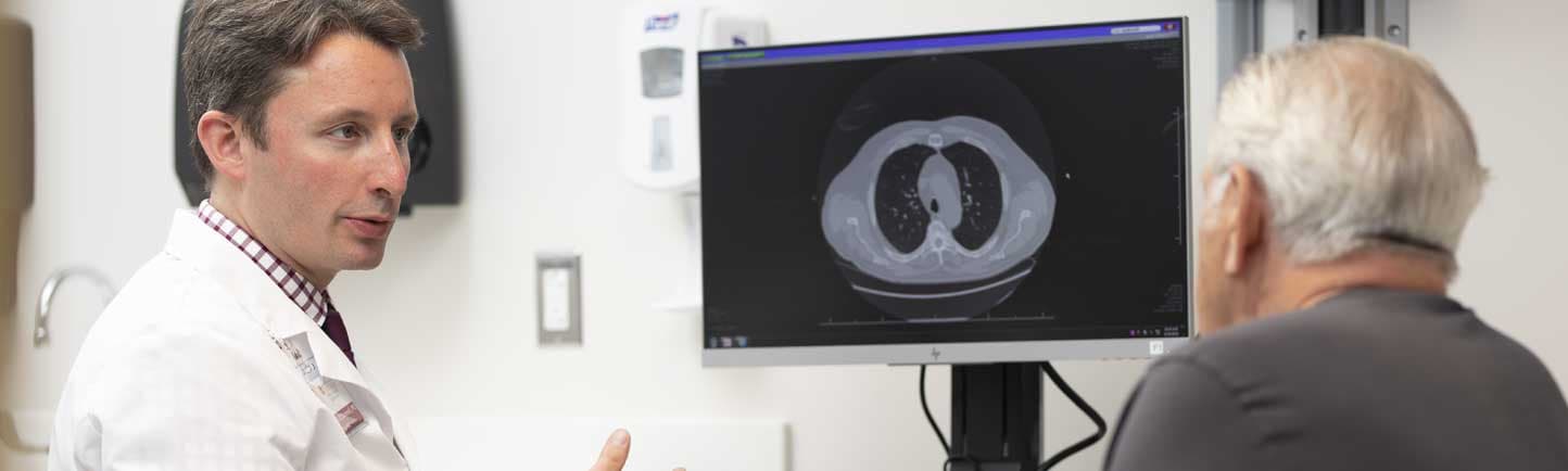 Medical oncologist Peter O'Donnell, MD, meets with a patient