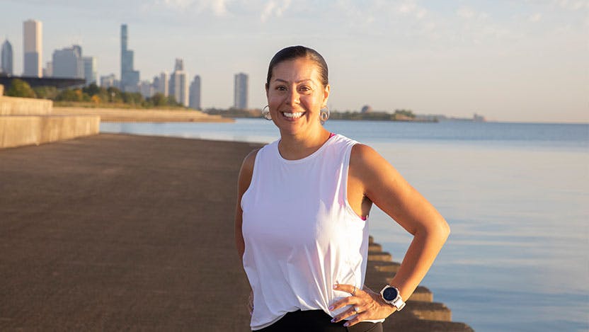 Marathon runner and breast cancer survivor Fabiola "Faby" Enriquez, of Hinsdale, takes a morning run along the lakefront at 31st Street.