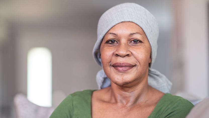 female Black cancer patient wearing headscarf