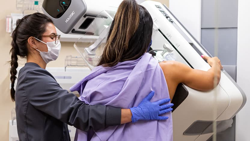 wide shot of woman getting mammogram at River East location