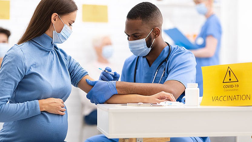 pregnant woman getting COVID-19 vaccine