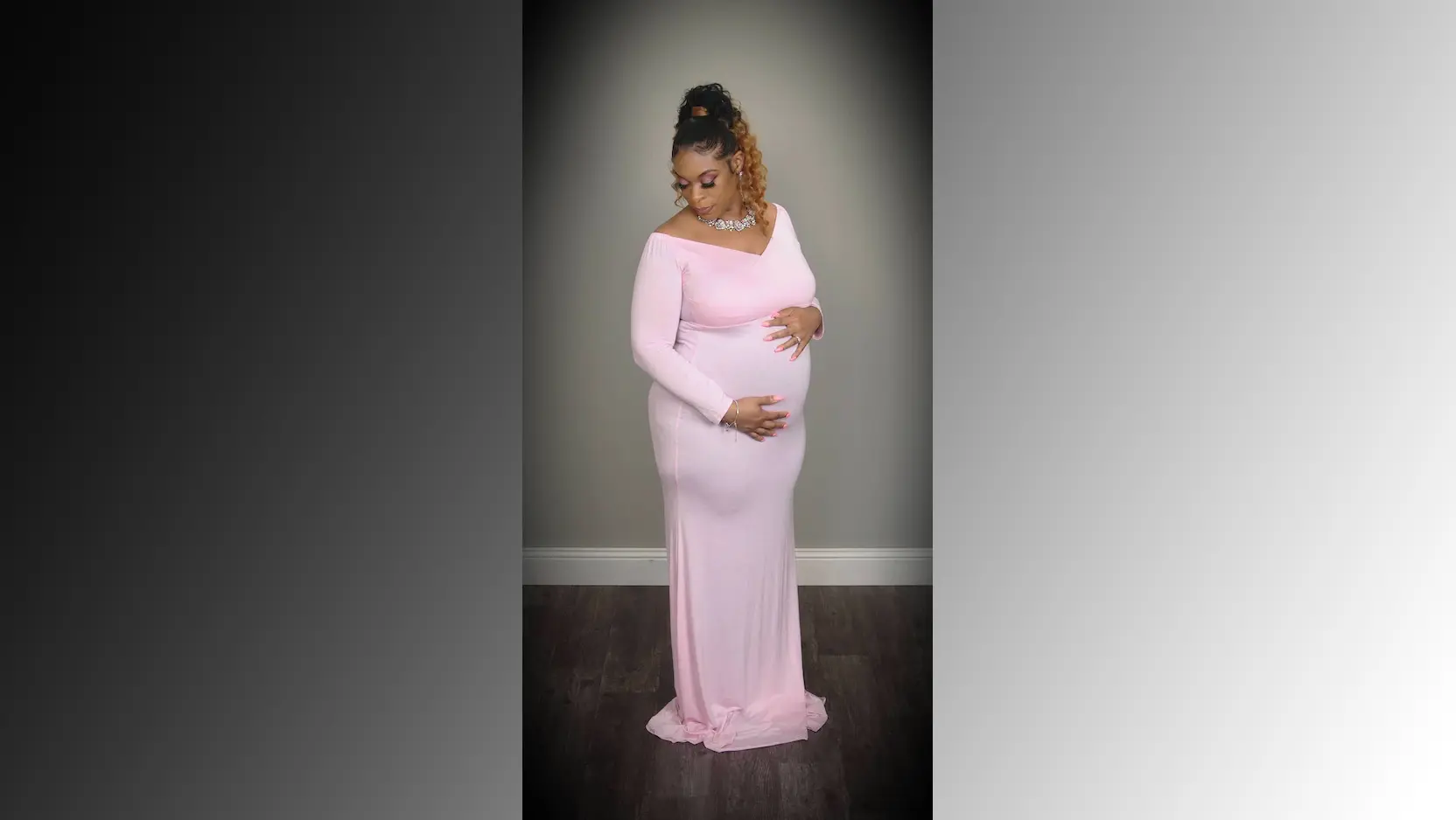 Porscha Lacey-Johnson poses in a pink gown, elegantly cradling her pregnancy belly