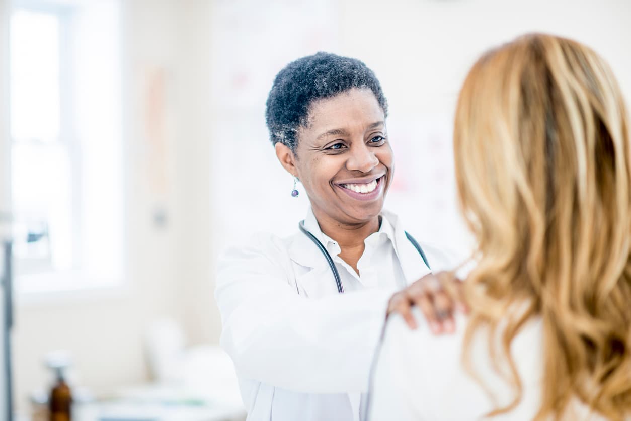 female doctor with patient with long hair