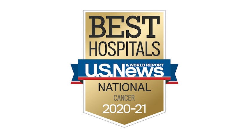 A gold logo with the text: Best Hospitals U.S. News & World Report National Cancer 2020-21.