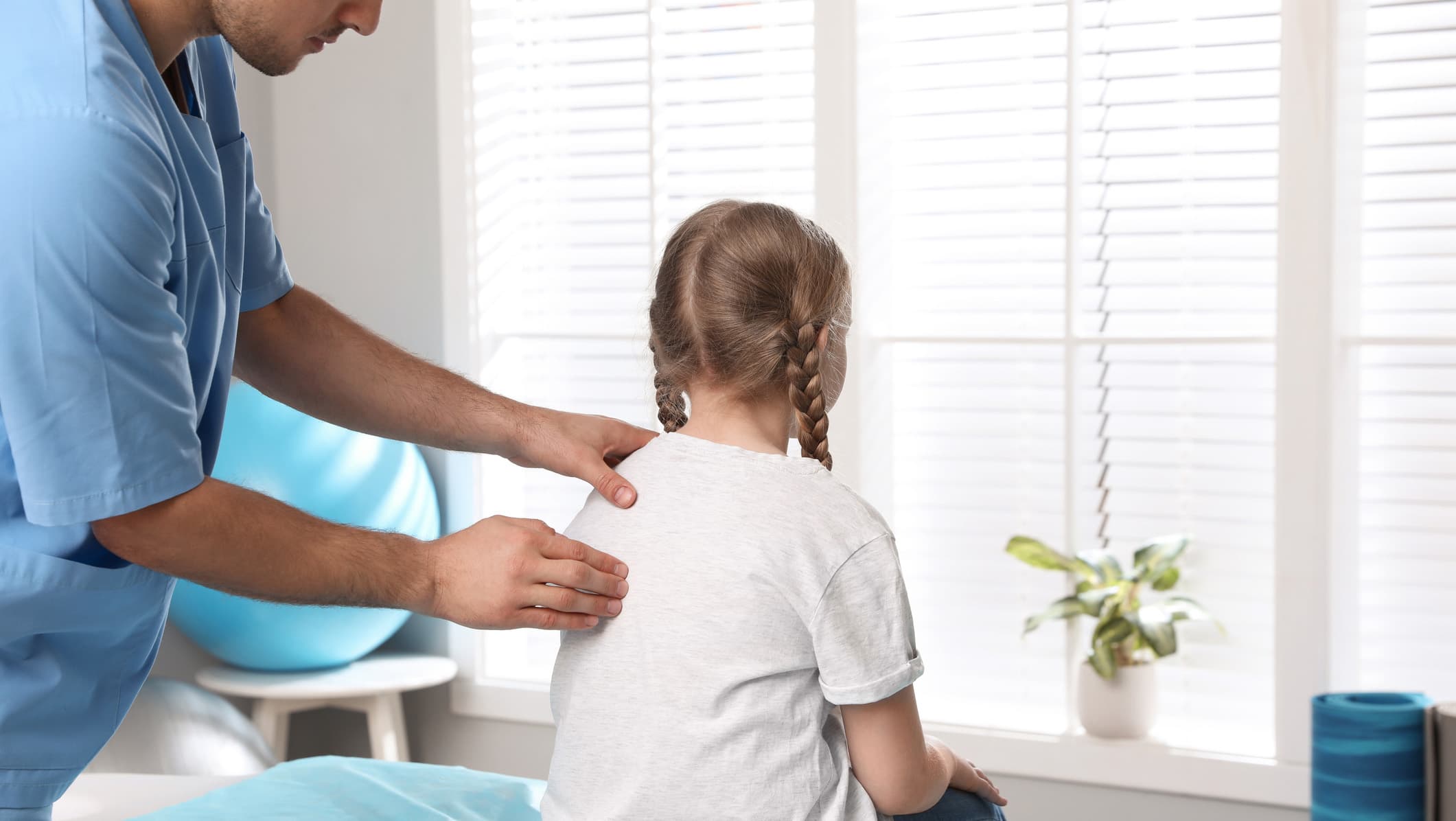 Child being tested for scoliosis