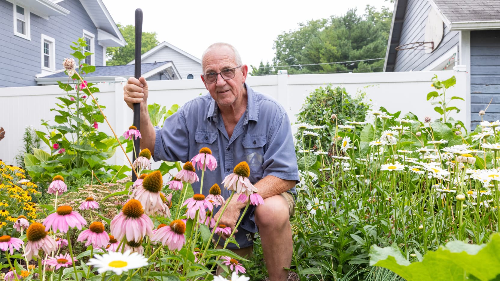 Spinal surgeon patient Steven poses while tending to his garden. Photos taken by Jordan Porter-Woodruff on 7/20/26