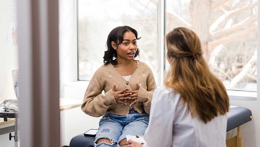 Physician is treating her patient