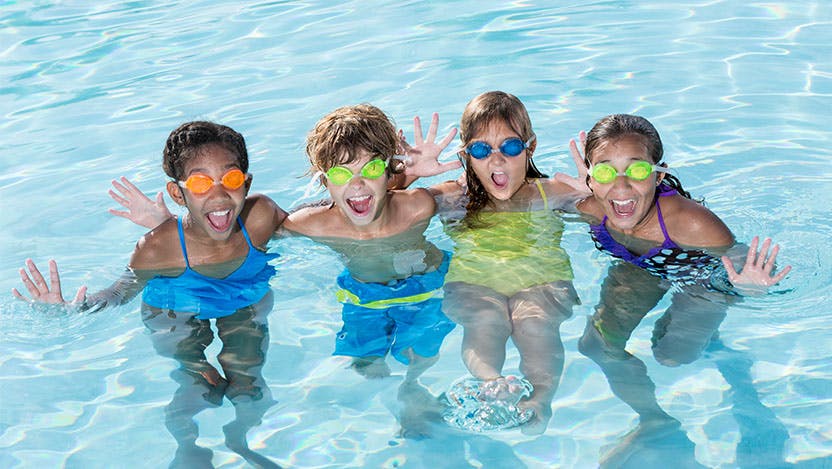 Image of kids having fun and playing safely in the pool