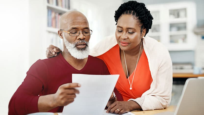 Couple reading paperwork