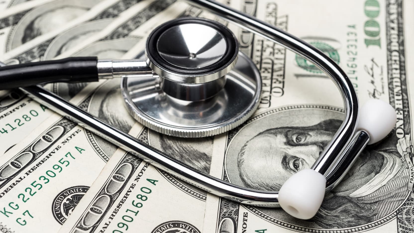 stethoscope on money