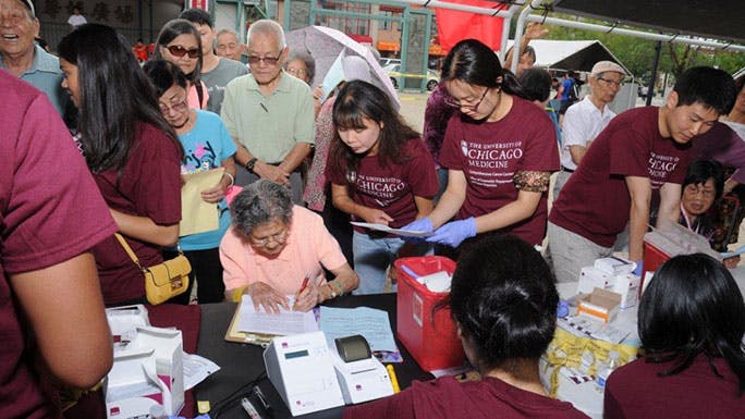 Asian Americans being screened for diabetes at a health fair in Chinatown, 2014