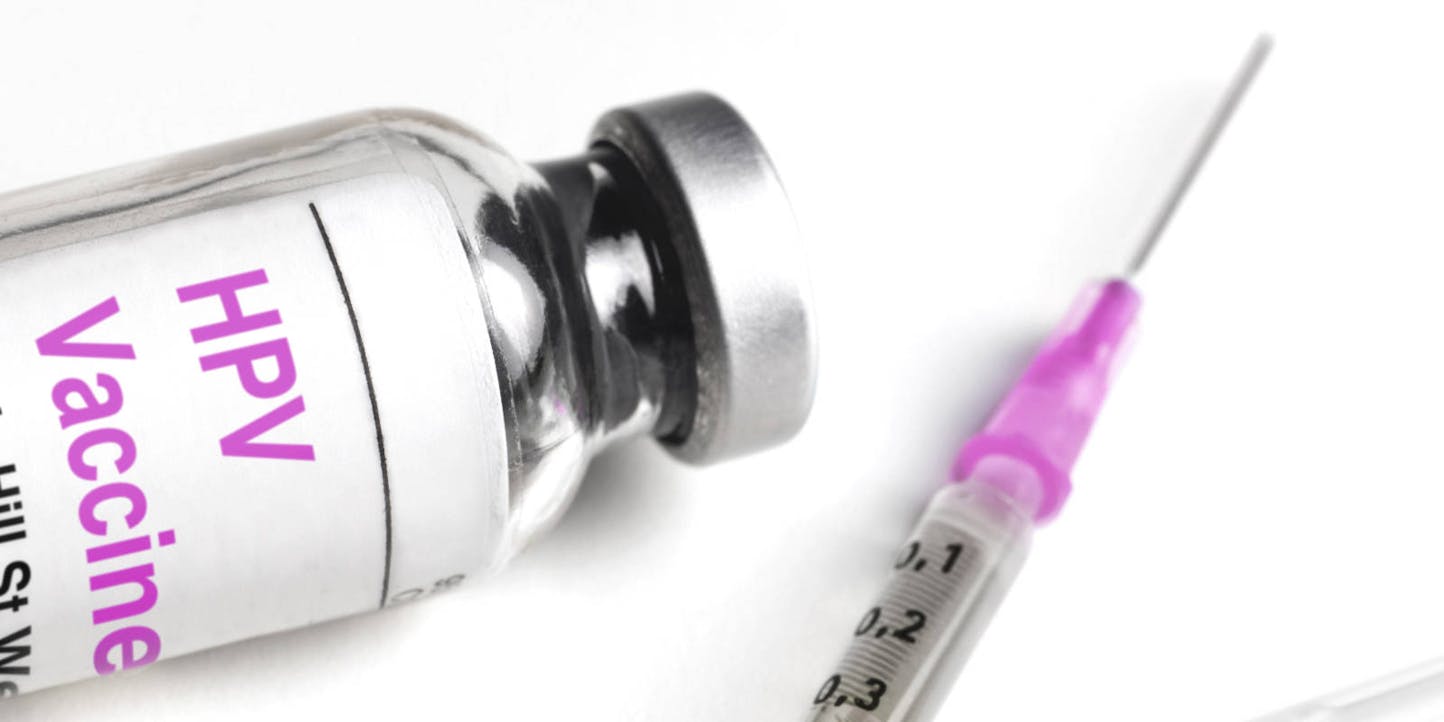 Vial of HPV vaccine and needle
