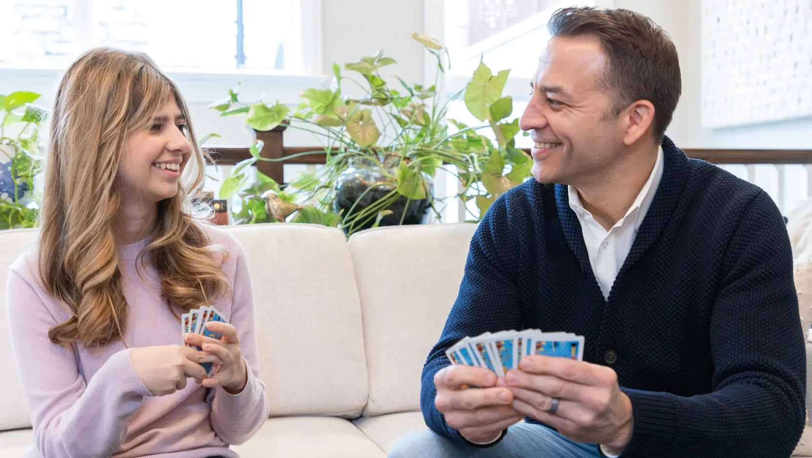 Berkley Blust and her father playing cards
