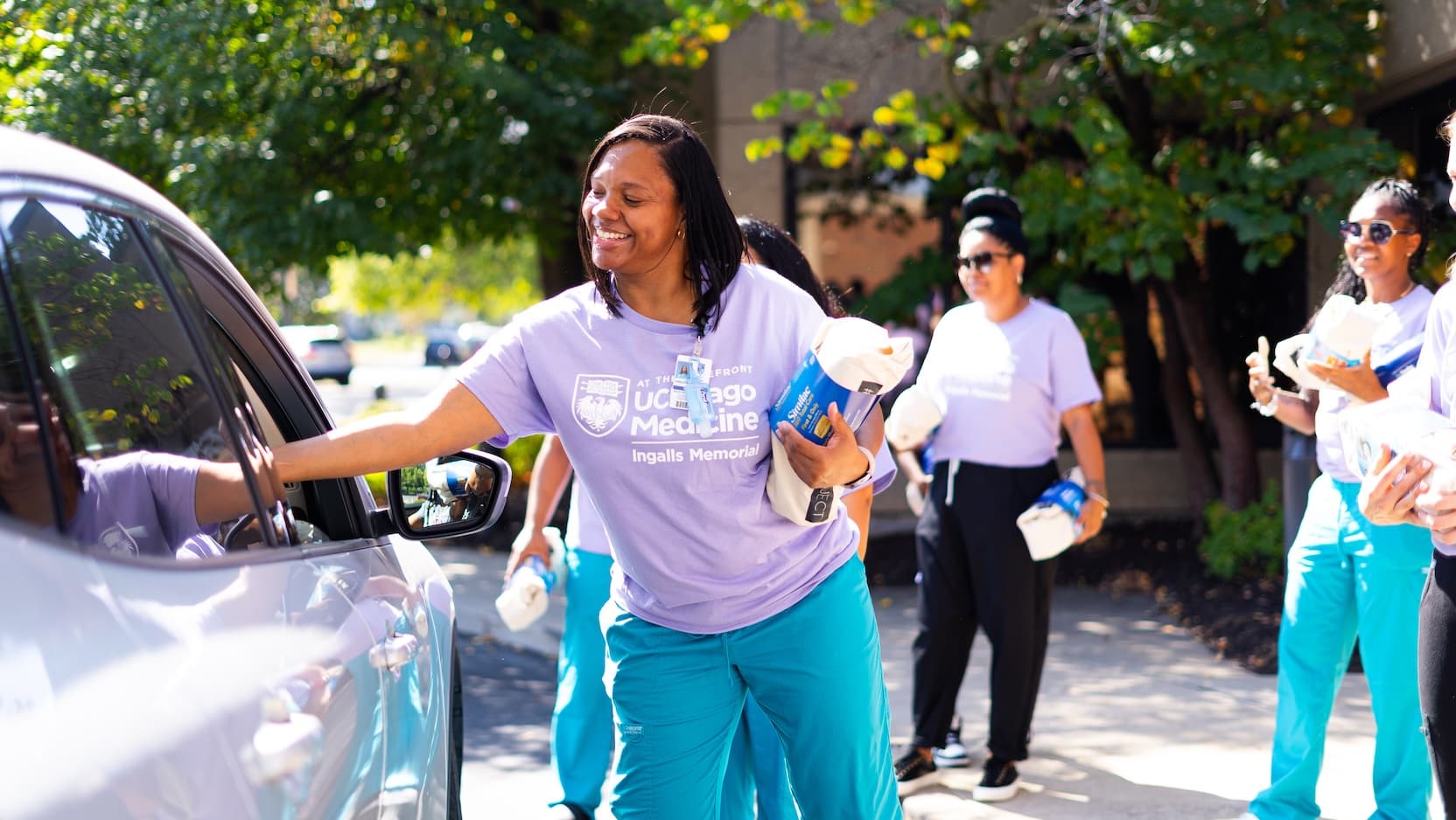 Staff at Ingalls hand out supplies at the 2024 Drive-Thru Baby Shower