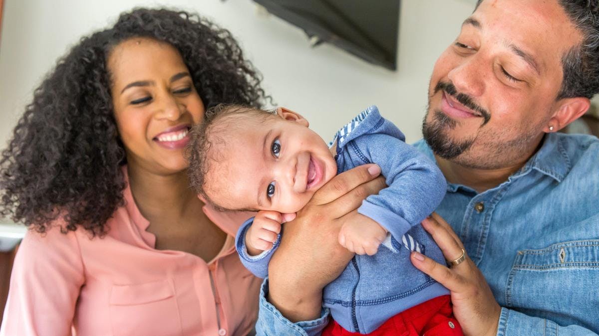 Keewa Nurullah and her husband, Douglas Freitag, snuggle their son, Faraz, who was born at the University of Chicago Medicine Family Birth Center in 2016.