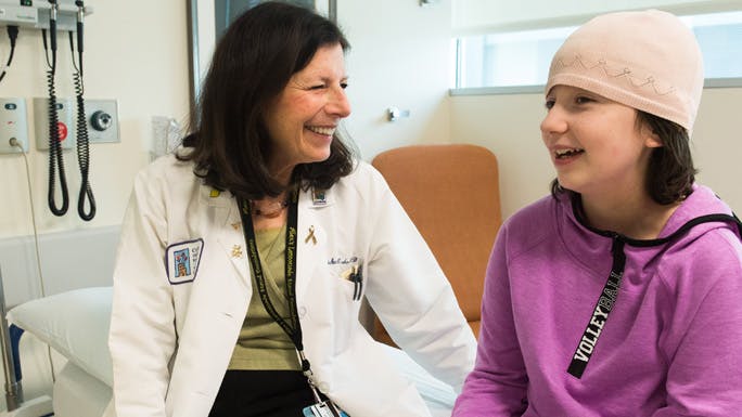 Pediatric hematologist/oncologist Susan Cohn, MD, meets with a patient