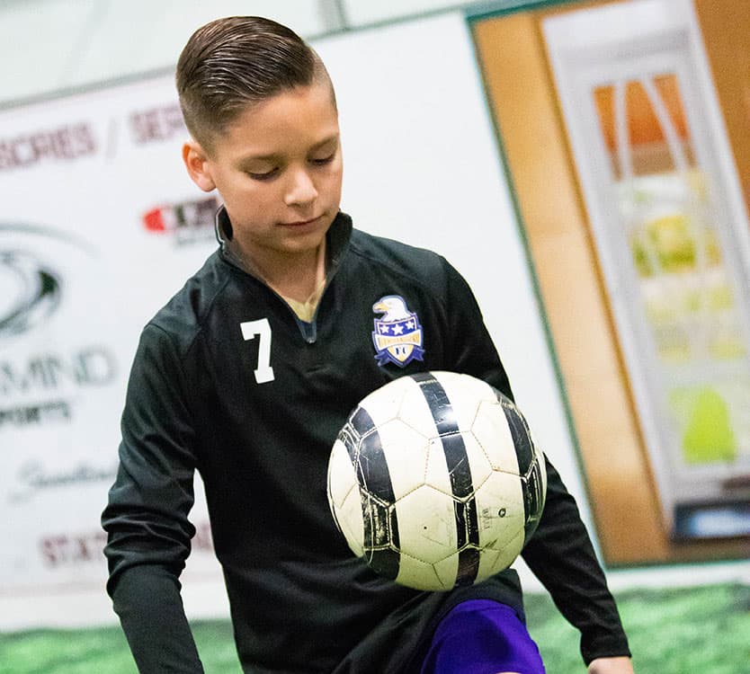 Islet transplant patient, Luke Clouser, warming up at soccer practice