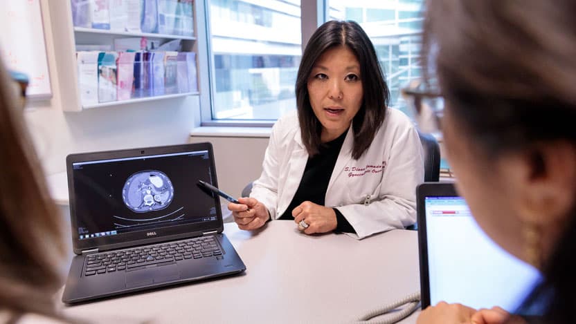 S. Diane Yamada, MD, points to an anatomical image on a laptop