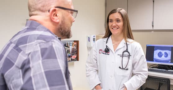 Christina Bestvina, MD, medical oncologist, and patient