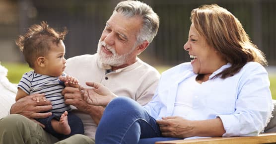 Older Hispanic couple with grandson