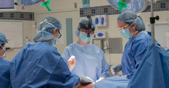 Nora Jaskowiak, MD, in surgery with staff