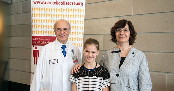 Stefano Guandalini (MD), patient Sofia Rocca, and Bana Jabri (MD, PhD) pose for a photo together at the Celiac Disease Center's research labs in the Knapp Center for Biomedical Discovery
