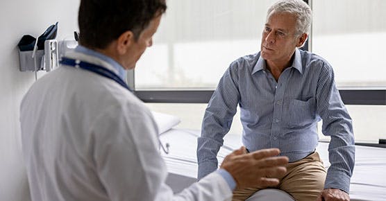 Image of male celiac disease patient asking questions to his doctor
