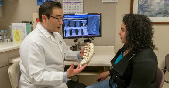 Michael Lee, MD, and patient in clinic