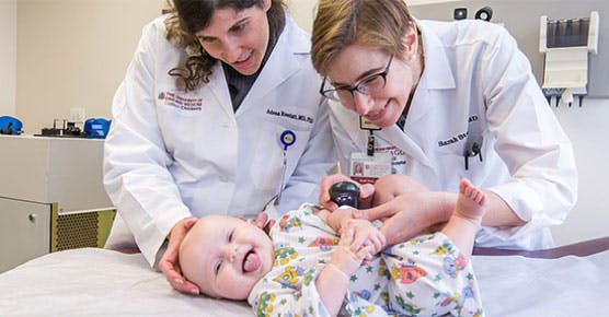 Adena Rosenblatt, MD, and Sarah Stein, MD, with infant patient