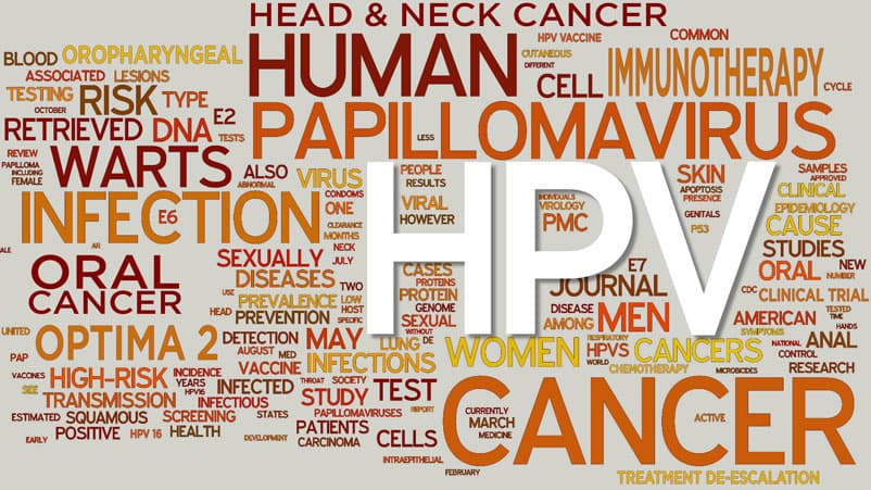 Doctor sitting on cabinet looking right, looking happy