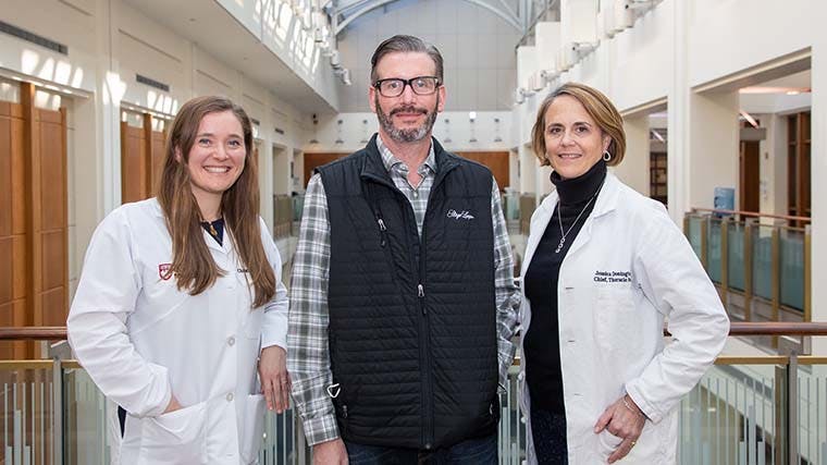 Patient John Polo with oncologist Christine Bestvina, MD, left, and surgeon Jessica Donington, MD.